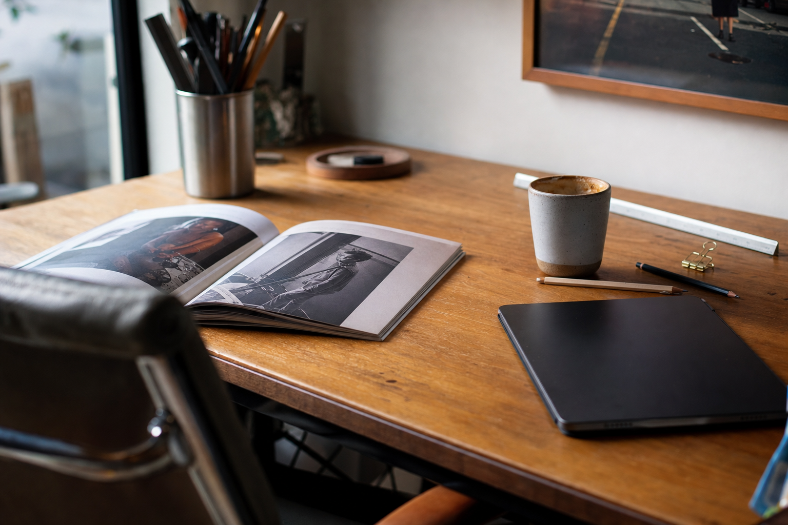 Editorial flat-lay of AI-generated ad creative across print and tablet